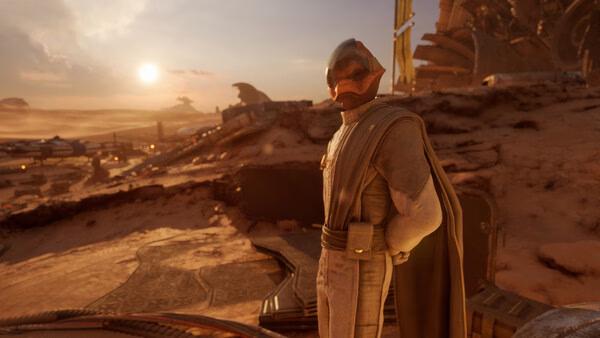 Screenshot from STAR WARS: Galactic Racer™ showing a character in a desert landscape with structures and a sunset in the background.