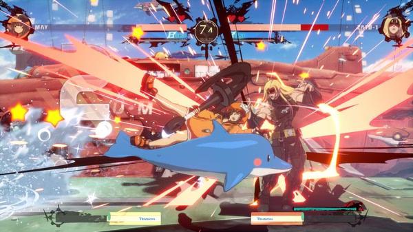 Screenshot from GUILTY GEAR -STRIVE- showing May mid-attack with a dolphin against another character amidst explosive effects.