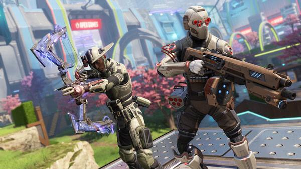 Apex Legends™ screenshot showing two characters in futuristic armor, one with a bow and the other with a rifle, in a vibrant outdoor setting.