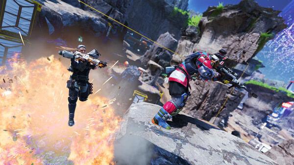 Apex Legends™ screenshot: Two characters engage in a dynamic firefight amidst rocky terrain, with one leaping from an explosion.