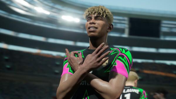 A screenshot from eFootball™ showing a football player celebrating a goal with crossed arms in a stadium.