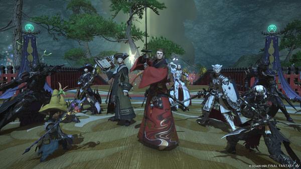 Group of players in elaborate costumes pose in a scenic area in this FINAL FANTASY XIV Online screenshot.
