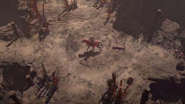 Diablo® IV screenshot showing a lone armored character on horseback in a barren, rocky landscape surrounded by eerie red spikes.