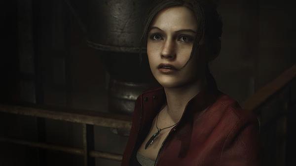 Resident Evil 2 screenshot: A character in a red jacket stands indoors, with dim lighting highlighting her necklace.