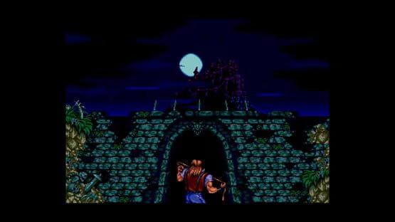 Screenshot from Castlevania Anniversary Collection showing a character facing a castle under a moonlit night sky.