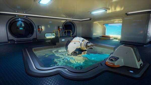 Subnautica 2 screenshot: A futuristic underwater base interior with a central pool, surrounded by high-tech equipment and ocean views.