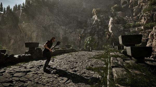 A Gothic 1 Remake screenshot showing a warrior with a mace facing a large green creature on a stone bridge in a mountainous area.