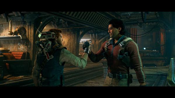 Screenshot from STAR WARS Jedi: Survivor™ shows two characters shaking hands in a dimly lit, industrial setting.