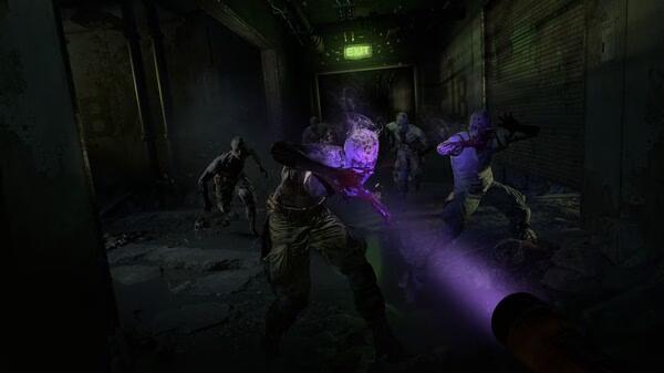 A screenshot from Dying Light 2 Stay Human: Reloaded Edition shows a player using UV light against attacking zombies in a dark hallway.