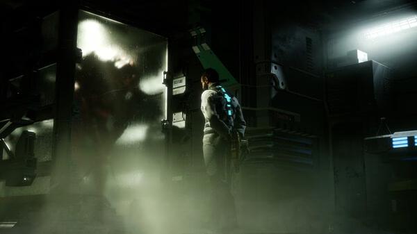Dead Space screenshot: A lone figure stands facing a foggy glass enclosure with a shadowy creature inside, surrounded by dim lighting and machinery.