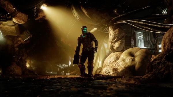 Dead Space screenshot: A character in a glowing helmet and armor stands in a dimly lit, alien-infested corridor with organic walls.