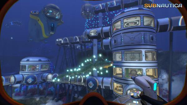 Subnautica screenshot: An underwater base with cylindrical structures and a sea creature swimming nearby, viewed from a player's perspective.