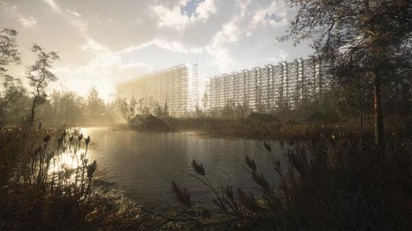 Screenshot from S.T.A.L.K.E.R. 2: Heart of Chornobyl showing a serene lake with towering radar structures in the background.