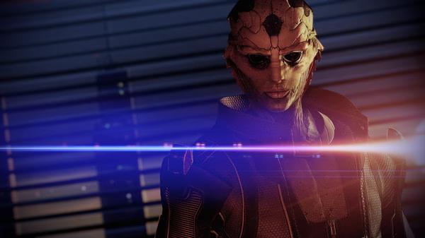 Mass Effect™ Legendary Edition screenshot featuring a character in futuristic armor with dramatic lighting and a blurred background.