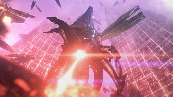 Mass Effect™ Legendary Edition screenshot: A Reaper ship in space amidst explosions and debris against a glowing, grid-like backdrop.