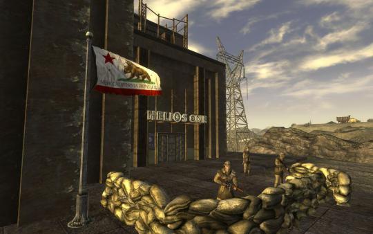 Screenshot from Fallout: New Vegas showing soldiers guarding Helios One with a New California Republic flag in the foreground.