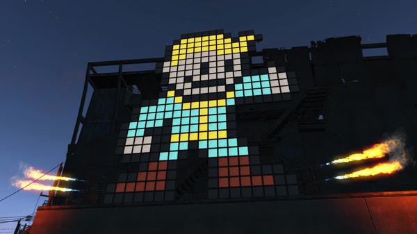 Fallout 4 screenshot: A pixel art of Vault Boy is displayed on a building facade, illuminated against a night sky.