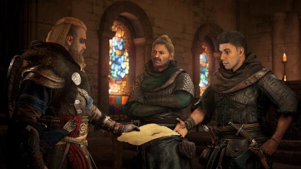 Screenshot from Assassin's Creed Valhalla showing characters in medieval attire discussing a map in a candlelit stone room.