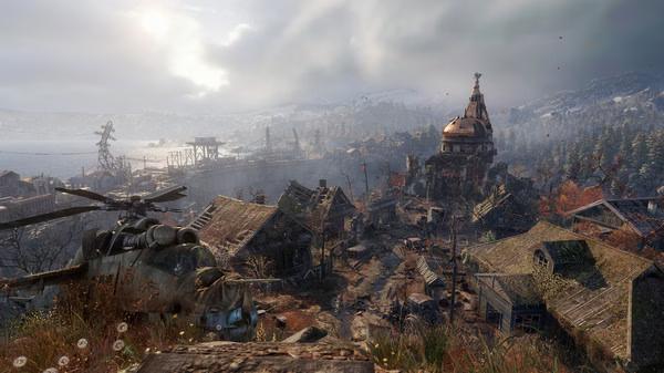 A scenic screenshot from Metro Exodus showing a detailed post-apocalyptic village with a helicopter and distant mountains.