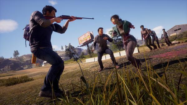 State of Decay 2: Juggernaut Edition screenshot showing survivors fighting zombies in a grassy area under a clear sky.