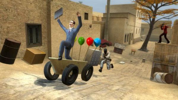 Garry's Mod screenshot: A character in a suit rides a balloon cart, while another runs behind in a desert town scene.