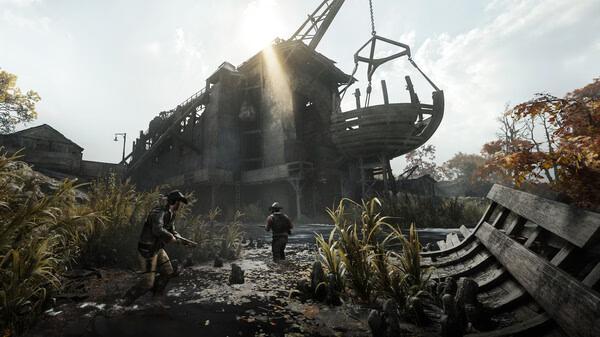 Screenshot from Hunt: Showdown 1896 showing two players navigating a swamp near a rundown building under a bright sky.
