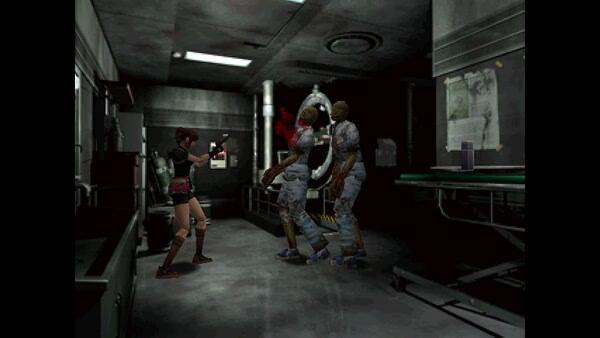Resident Evil 2 (1998) screenshot: A character aims a pistol at two approaching zombies in a dimly lit lab.