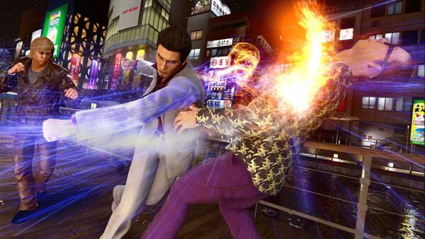 Yakuza Kiwami 2 screenshot: A character in white delivers a fiery punch to an opponent on a busy street at night.