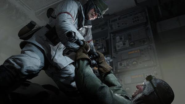 Indiana Jones and the Great Circle screenshot: Two characters struggle in a dimly lit control room filled with electronic equipment.