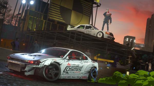 Need for Speed Unbound screenshot: A white car speeds past as another car is parked on a ramp with a person standing on it.