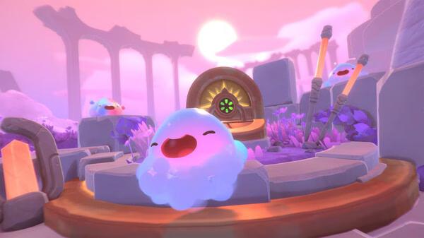 Slime Rancher 2 screenshot: A cheerful blue slime sits in a vibrant, colorful landscape with ancient ruins in the background.