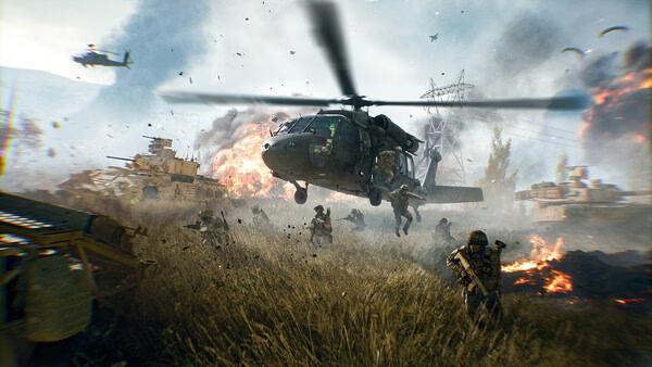 Battlefield 6 screenshot: Soldiers advance through a war-torn field as a helicopter hovers above amidst explosions.