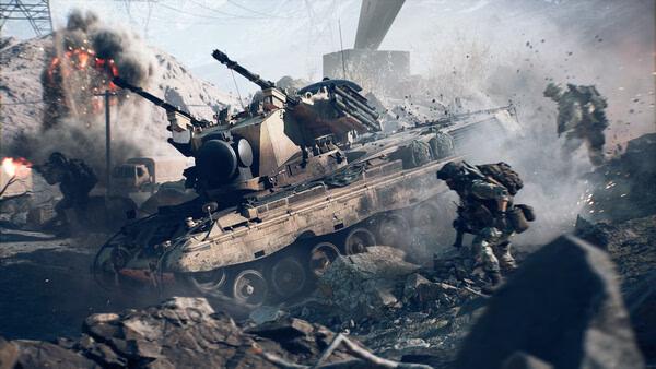 Battlefield 6 screenshot: A tank fires in a rocky battlefield as soldiers advance through smoke and debris in the background.