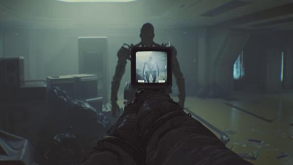 ROUTINE screenshot: A player aims at a humanoid figure through a weapon's scope in a dimly lit, futuristic interior setting.