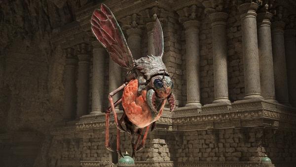 Screenshot from Fatekeeper showing a giant red insect with detailed wings in front of ancient stone columns in a cavern.
