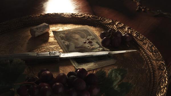 Screenshot from Mafia: The Old Country showing a decorative tray with a knife, grapes, and a blood-stained banknote.