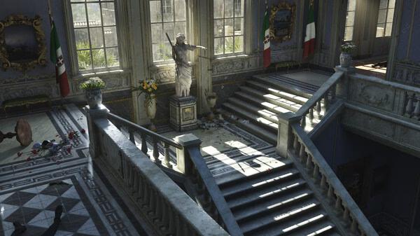Screenshot from Mafia: The Old Country showing a grand staircase with a statue and Italian flags in a sunlit hall.