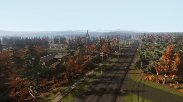 VEIN screenshot: A scenic view of a rural town with roads and houses surrounded by autumn-colored trees under a clear sky.