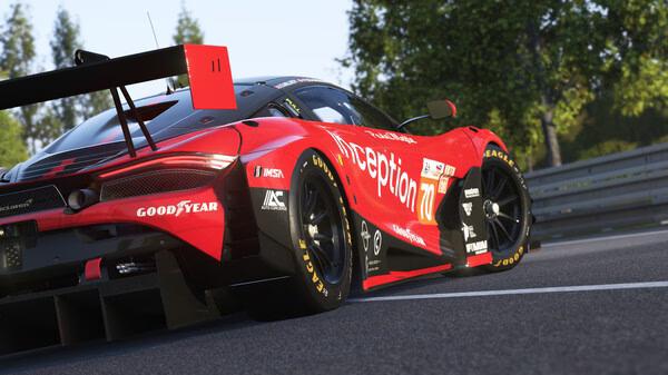 Le Mans Ultimate screenshot: A red race car speeds around a track, showcasing detailed graphics and realistic environments.