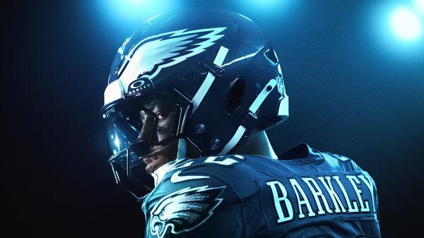 EA SPORTS Madden NFL 26 screenshot featuring a close-up of a player in an Eagles uniform under stadium lights, helmet labeled "Barkley."