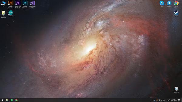 A Wallpaper Engine screenshot showing a galaxy-themed desktop background with various application icons on the top left corner.