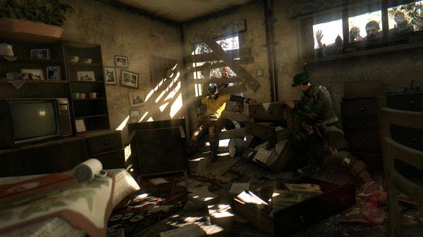 Dying Light screenshot: Two survivors search through a damaged room as sunlight streams in, with zombies visible outside the window.