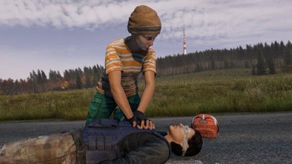 DayZ screenshot: A player performs CPR on another character lying on a road, with a forest and radio tower in the background.