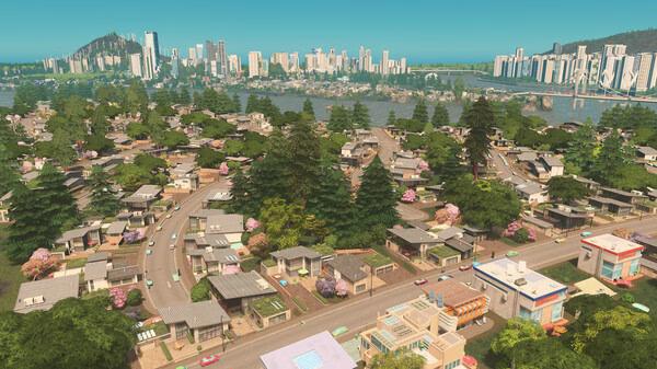 A screenshot from Cities: Skylines showing a sprawling suburban neighborhood with winding roads and distant city skyline.