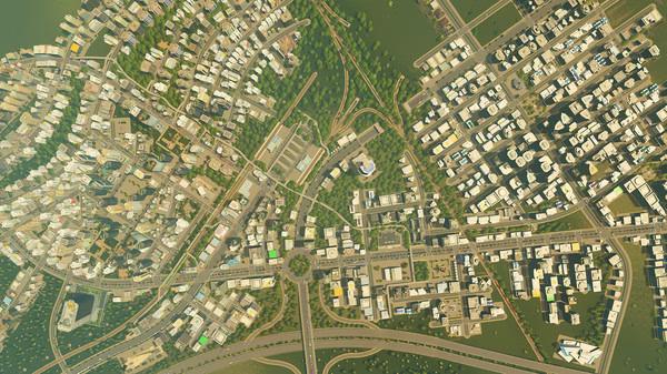 Cities: Skylines screenshot showing a sprawling city with dense residential and commercial buildings, roads, and green spaces.