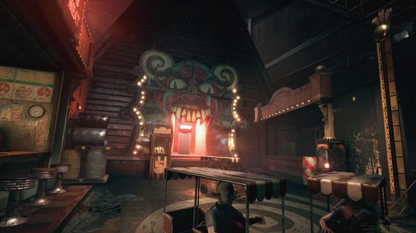 A screenshot from The Outlast Trials showing a creepy amusement park with a clown-faced building and abandoned carnival rides.