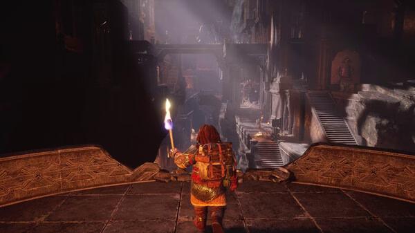 Screenshot from The Lord of the Rings: Return to Moria, showing a dwarf holding a torch in a vast, dimly lit cavern.