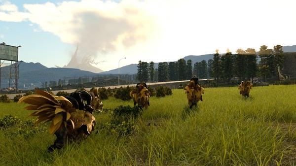 Screenshot from FINAL FANTASY XV WINDOWS EDITION shows a group of chocobos running through a grassy field with mountains in the background.