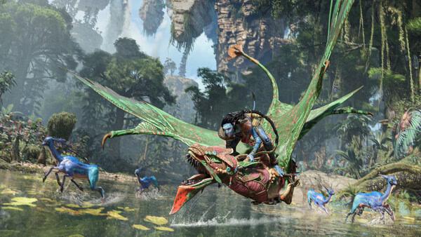Screenshot from Avatar: Frontiers of Pandora showing a character flying on a creature above a lush, alien landscape with exotic animals.