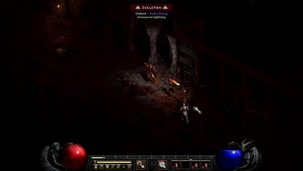 A screenshot from Diablo II: Resurrected showing a player battling skeletons in a dark dungeon with fiery weapons.